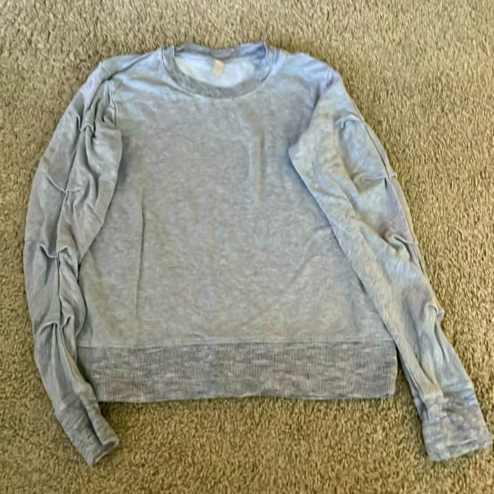 Gray sweatshirt by Athleta Girl w/Ribbon styled pleats pleats and thumb hooks.